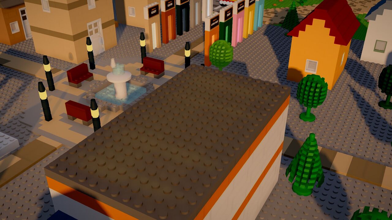 A brick-built town square with a fountain, benches, lamps and colorful houses
