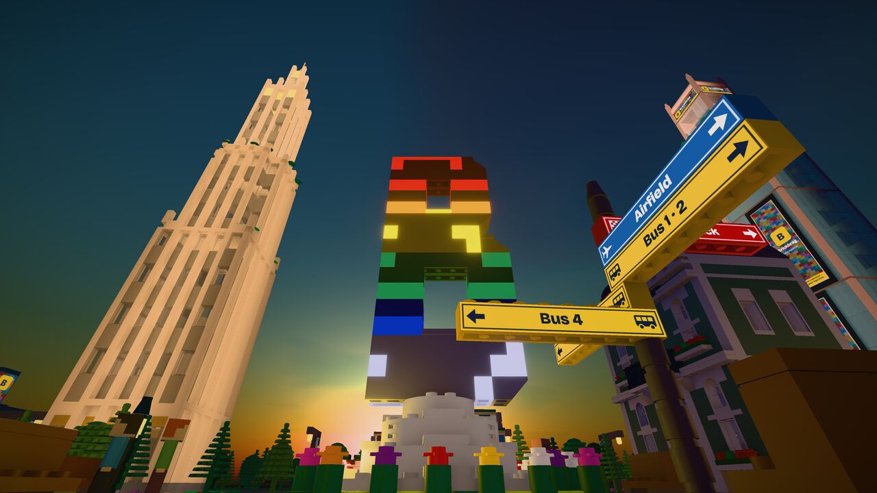 The rainbow B statue and the lookout tower at sunset, signposts to the airfield and the bus lines